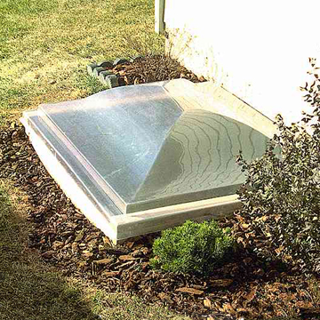 Egress window well covers by Bilco. Dome design protects the well opening and limits the collection of debris.  